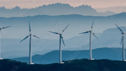 Renewable energy, wind energy with windmills.