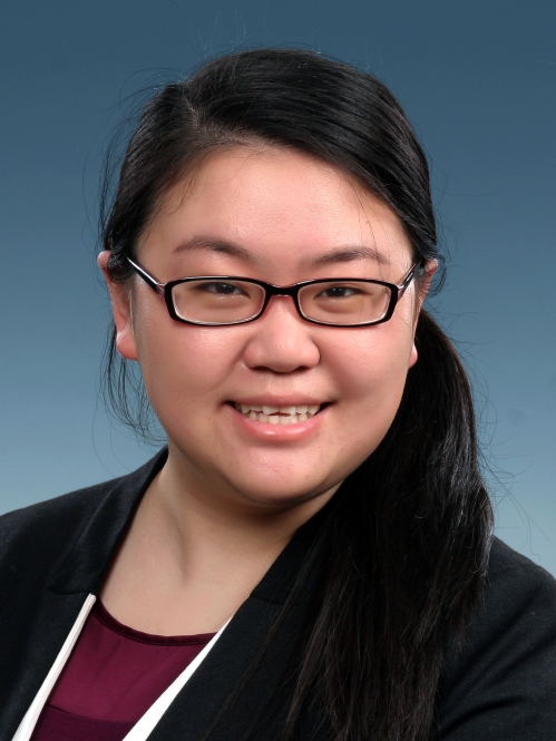 Headshot of an Asian female with eyeglasses, black hair pulled into a ponytail