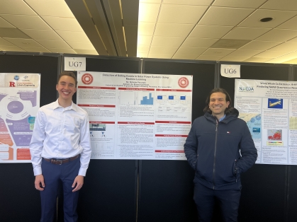 Undergraduate Nicholas Percarpio and Professsor Azziz Ezzat flanking research poster.