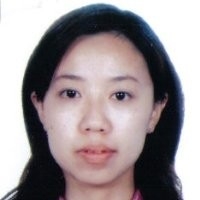 Head shot of Asian woamn with long black hair.